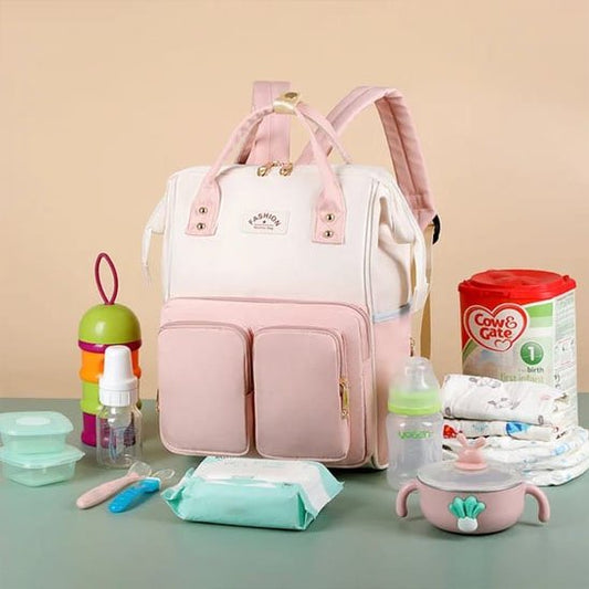 sac(à-langer-rose-avec-autour-lait-biberon-couches-ustensiles-bébés