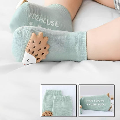 bébé porte chaussette bébé vert poisson