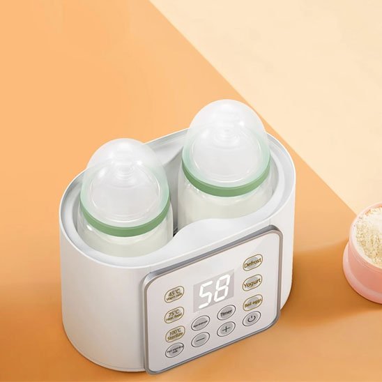 Chauffe biberon  pro blanc posé au chevet du lit