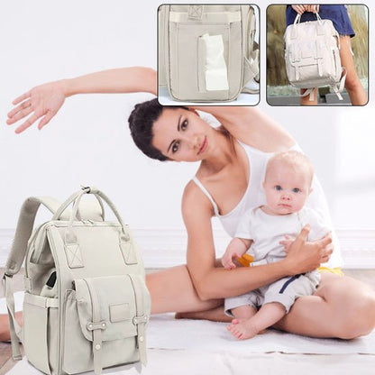 maman mode yoga avec bébé sur cuisse sac à langer tout près
