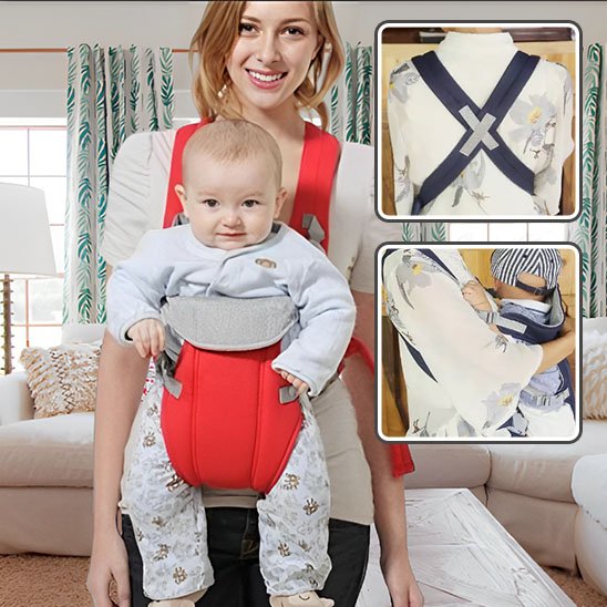 Maman  souriant avec bébé dans porte bébé rouge vive