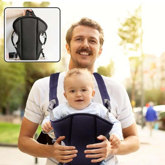 Papa souriant avec bébé dans porte bébé bleu nuit