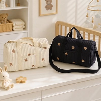 Sac a langer beige motif lapin et noir motif ours