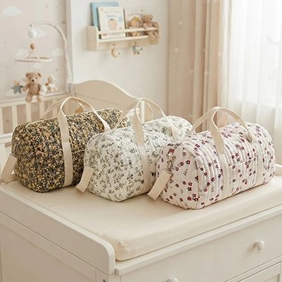 Trois sac a langer model 1 2 3 sur commode