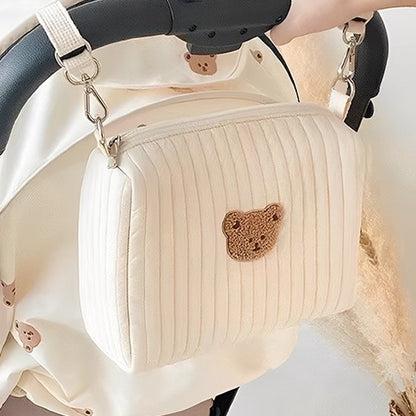 Trousse de toilette bebe accrochée à poussette